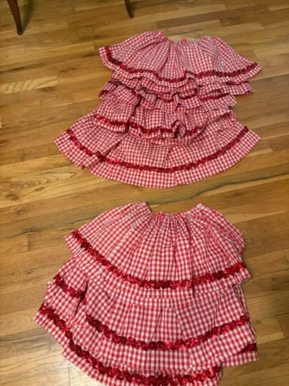 Eight Red Country Recital Skirts with Sashes